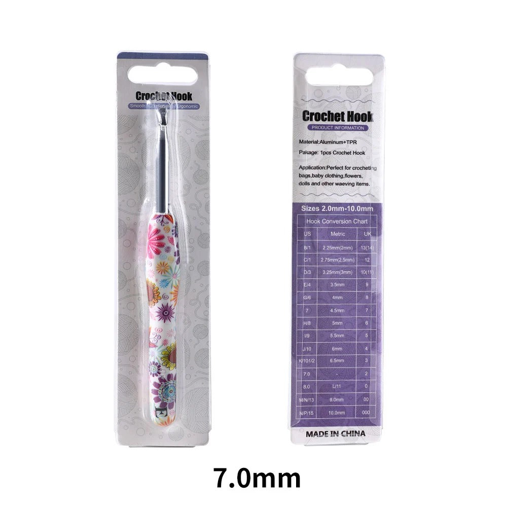 7mm Crochet hook with floral design in packaging on a white background