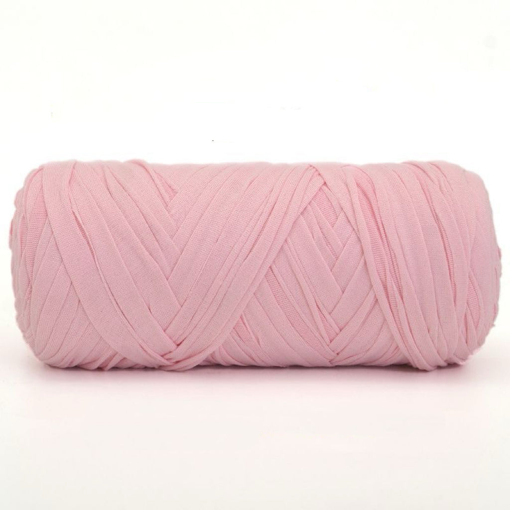 Pink yarn ball on a white background