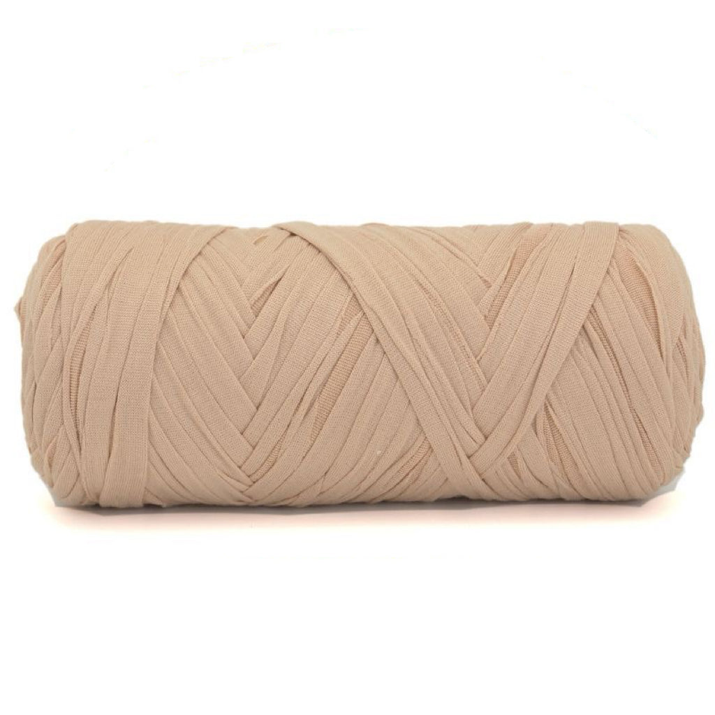 Beige skein of yarn on a white background