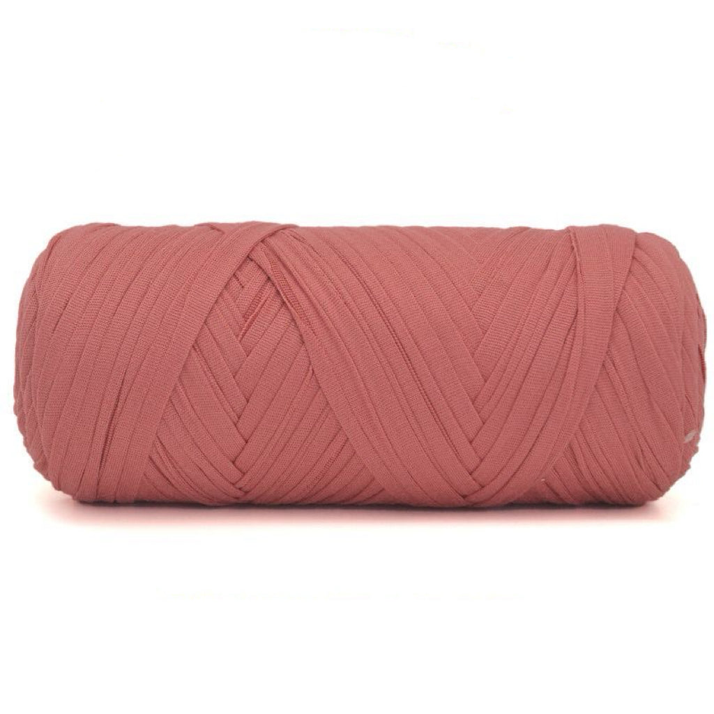 Pink skein of yarn on a white background