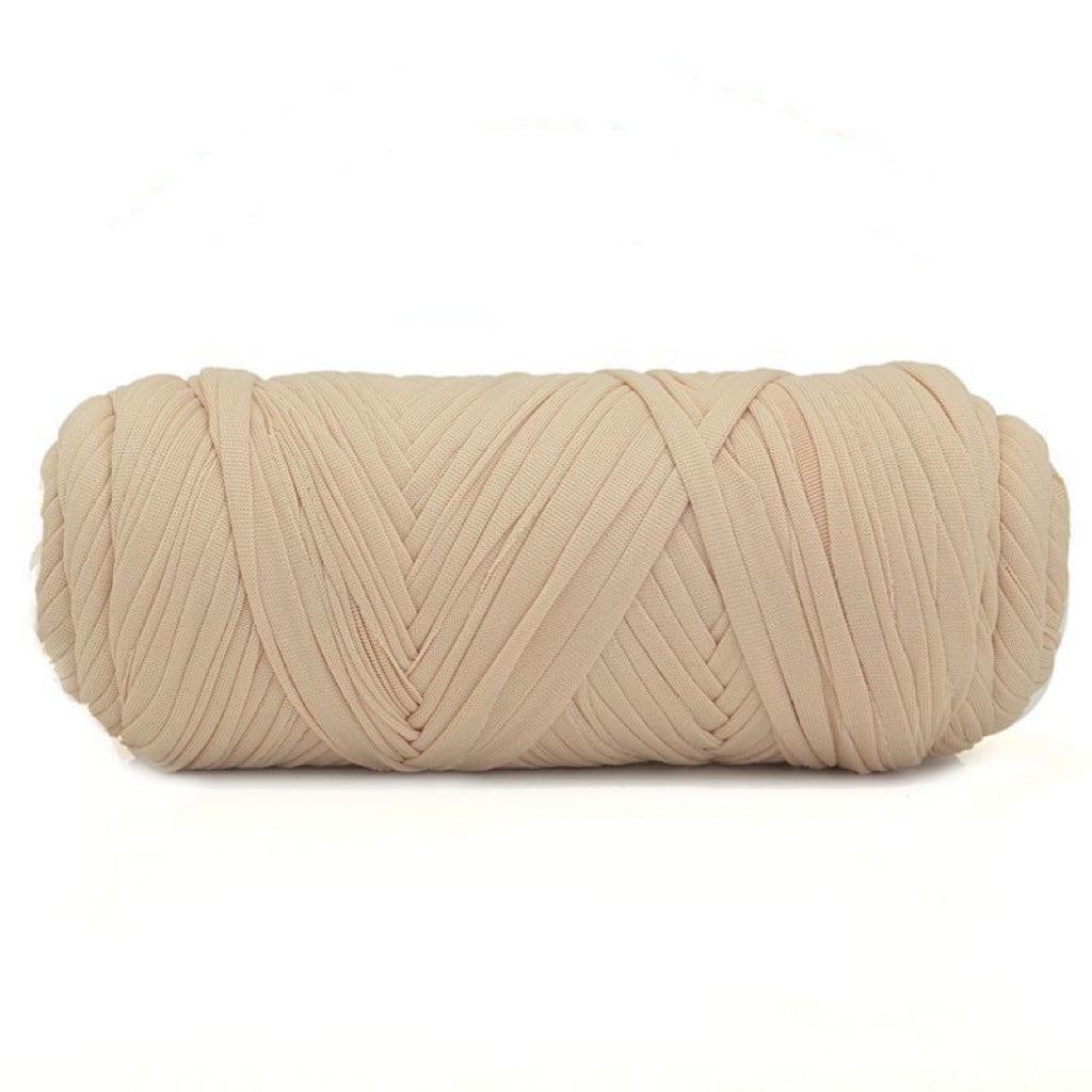 Beige skein of yarn on a white background