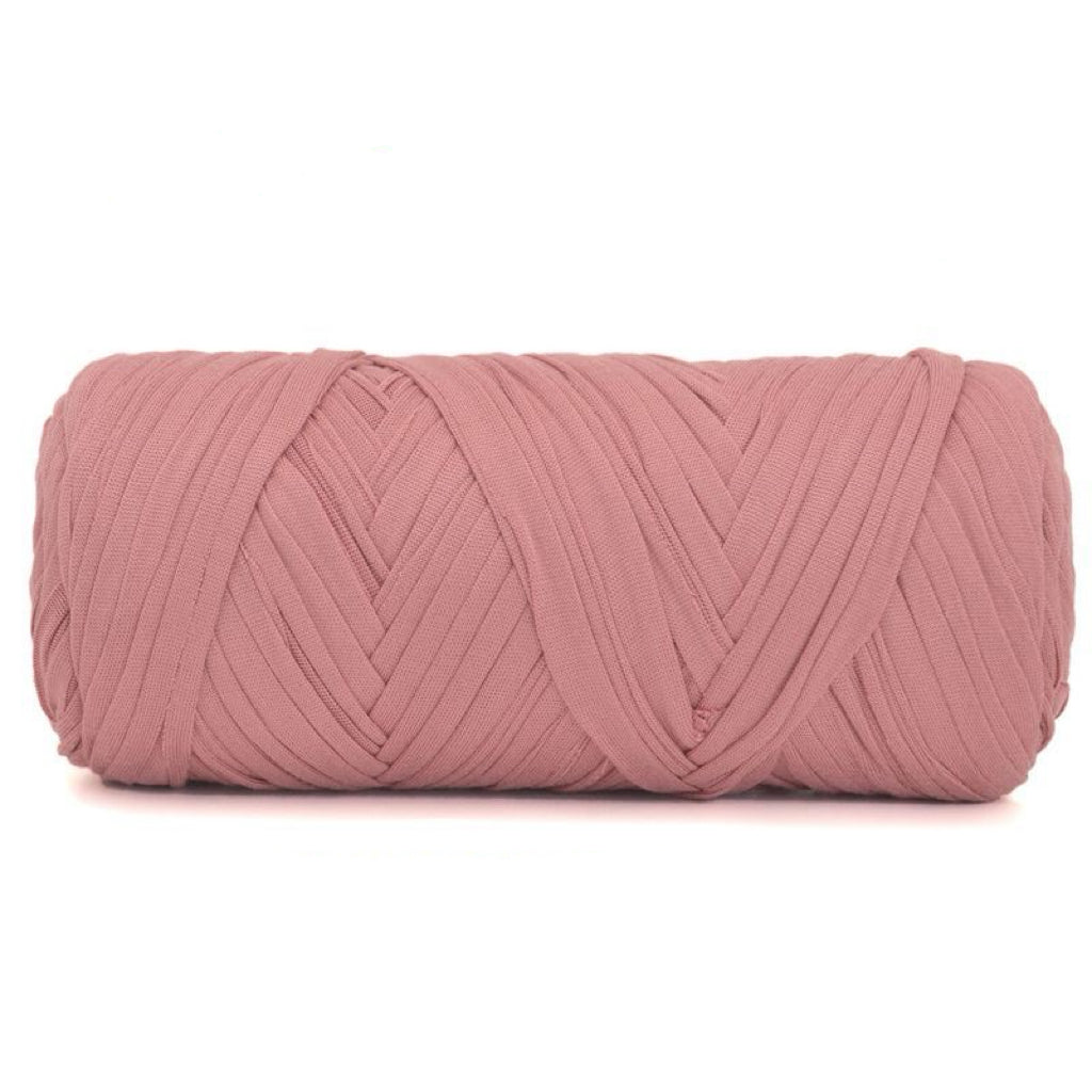 Pink yarn ball on a white background