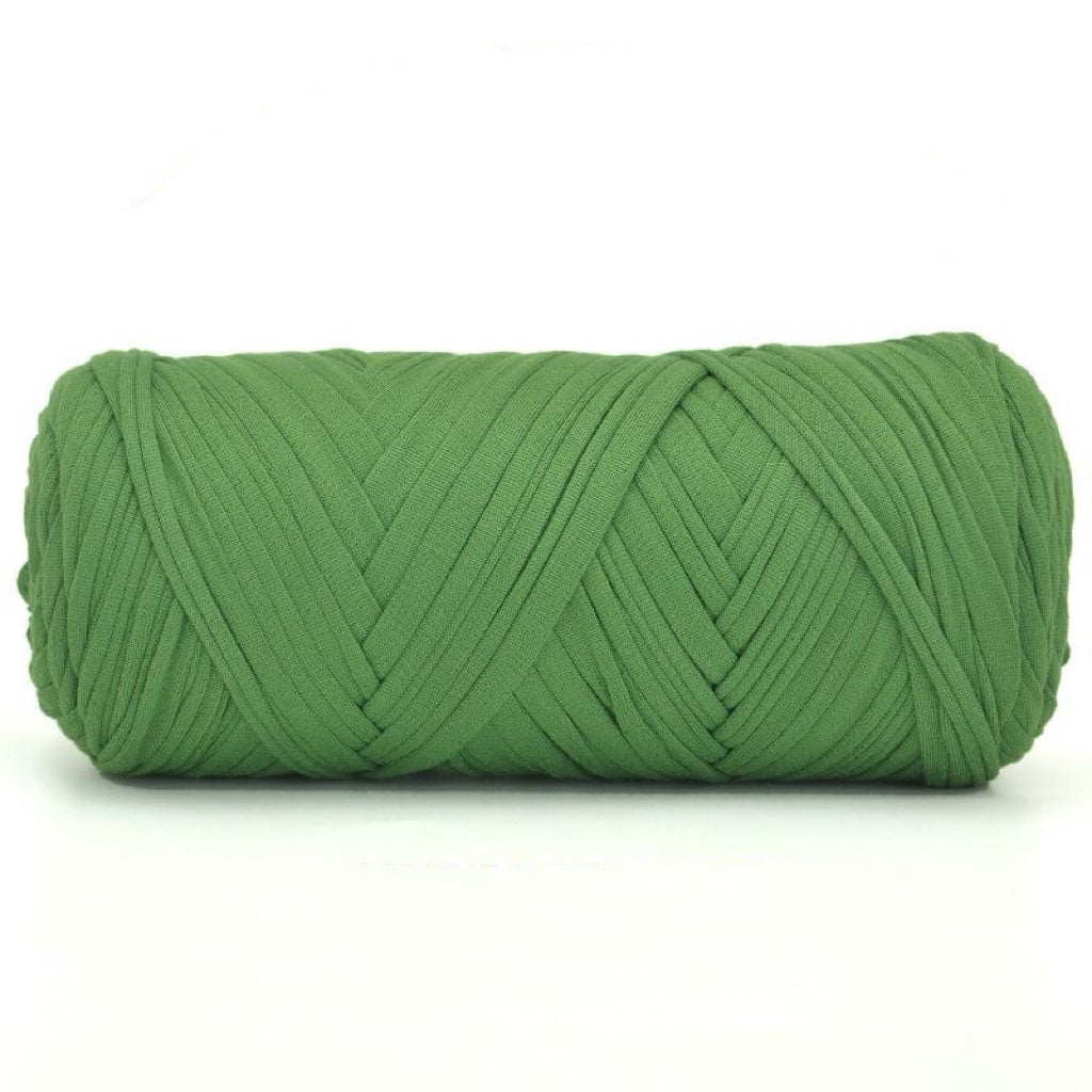 Green skein of yarn on a white background