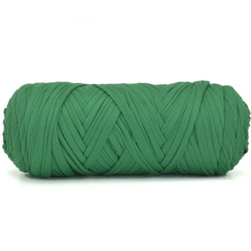 Green skein of yarn on a white background