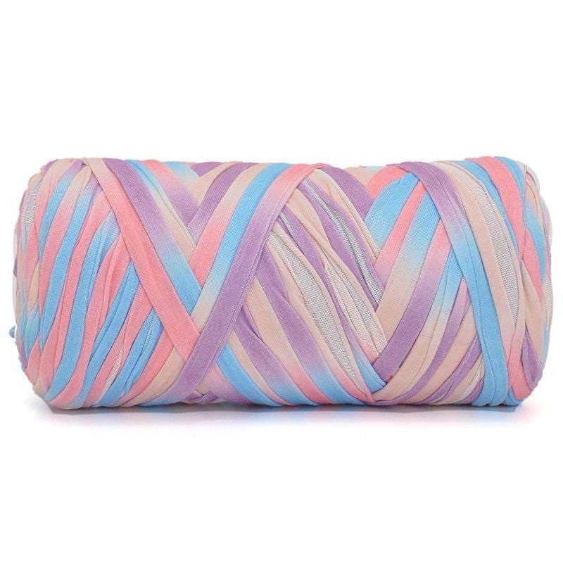 Rolled-up colorful fabric with pastel shades on a white background