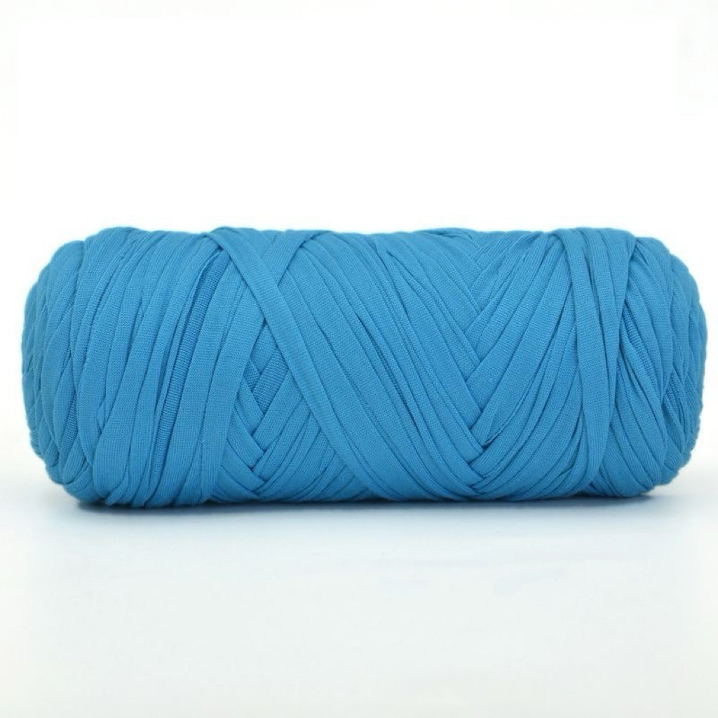 Blue skein of yarn on a white background