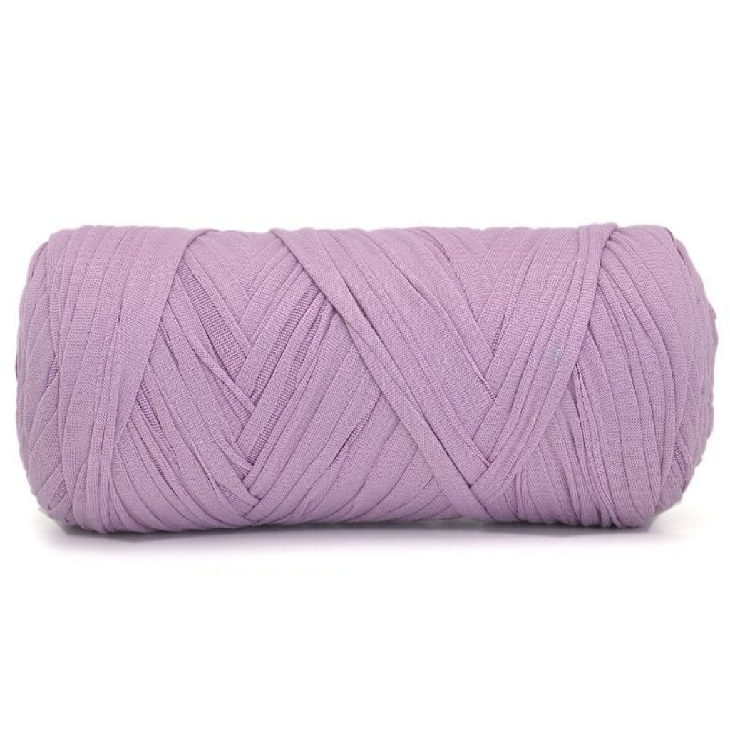 Purple skein of yarn on a white background