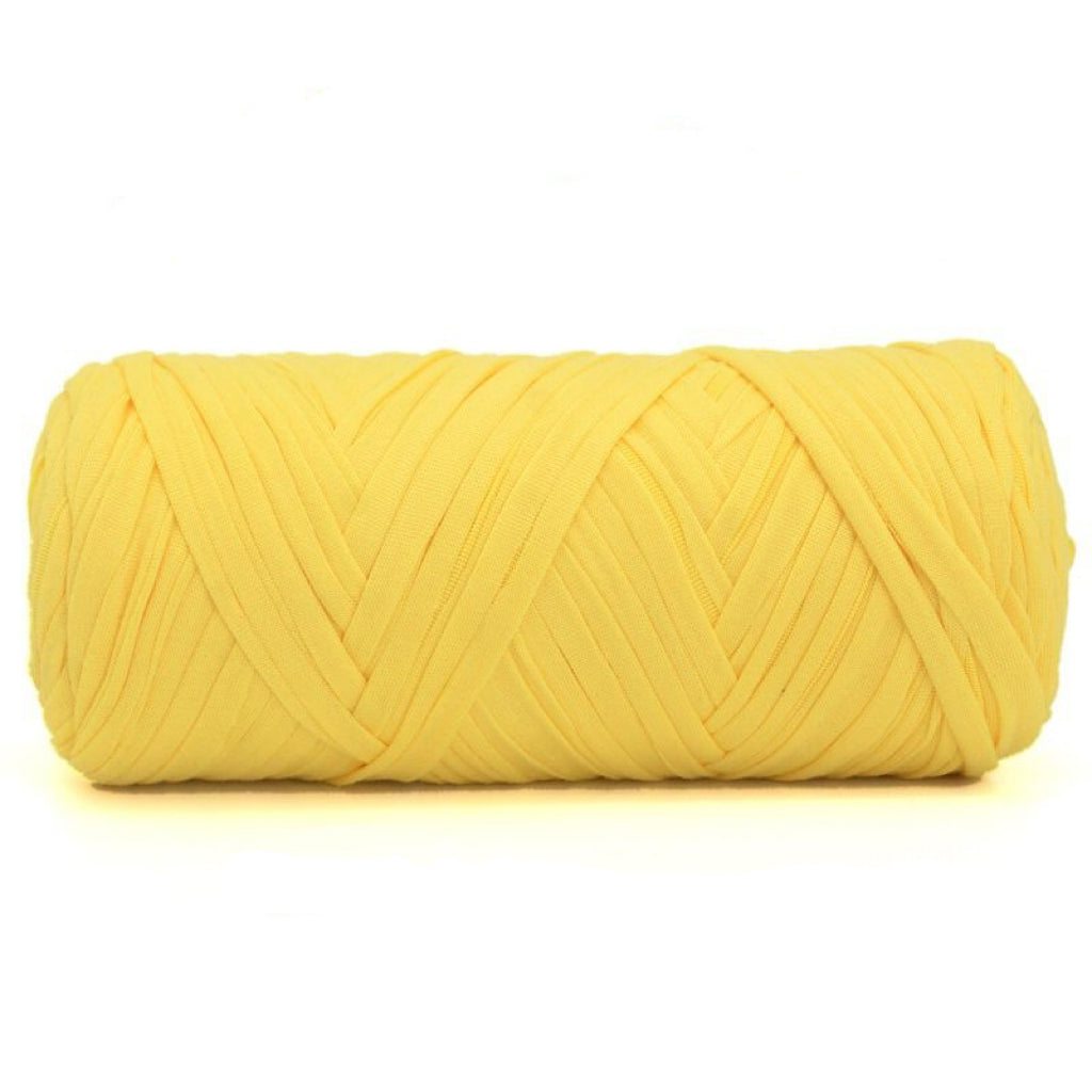 Yellow yarn ball on a white background