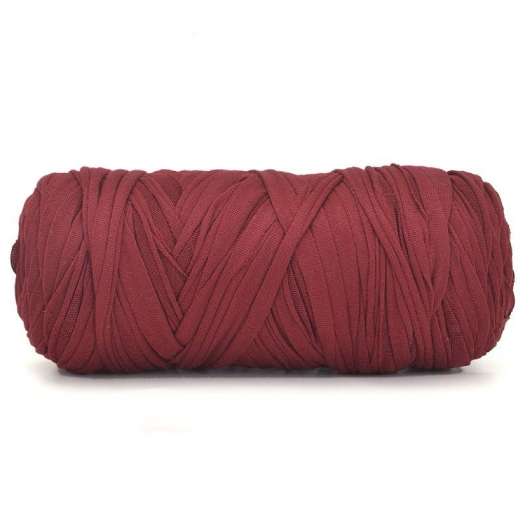 Red skein of yarn on a white background