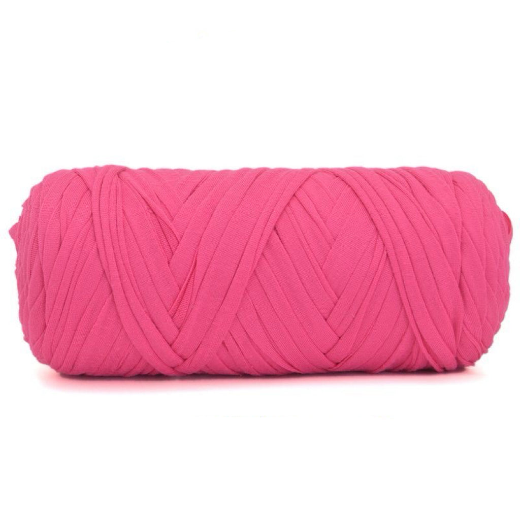 Pink T-shirt yarn ball on a white background.