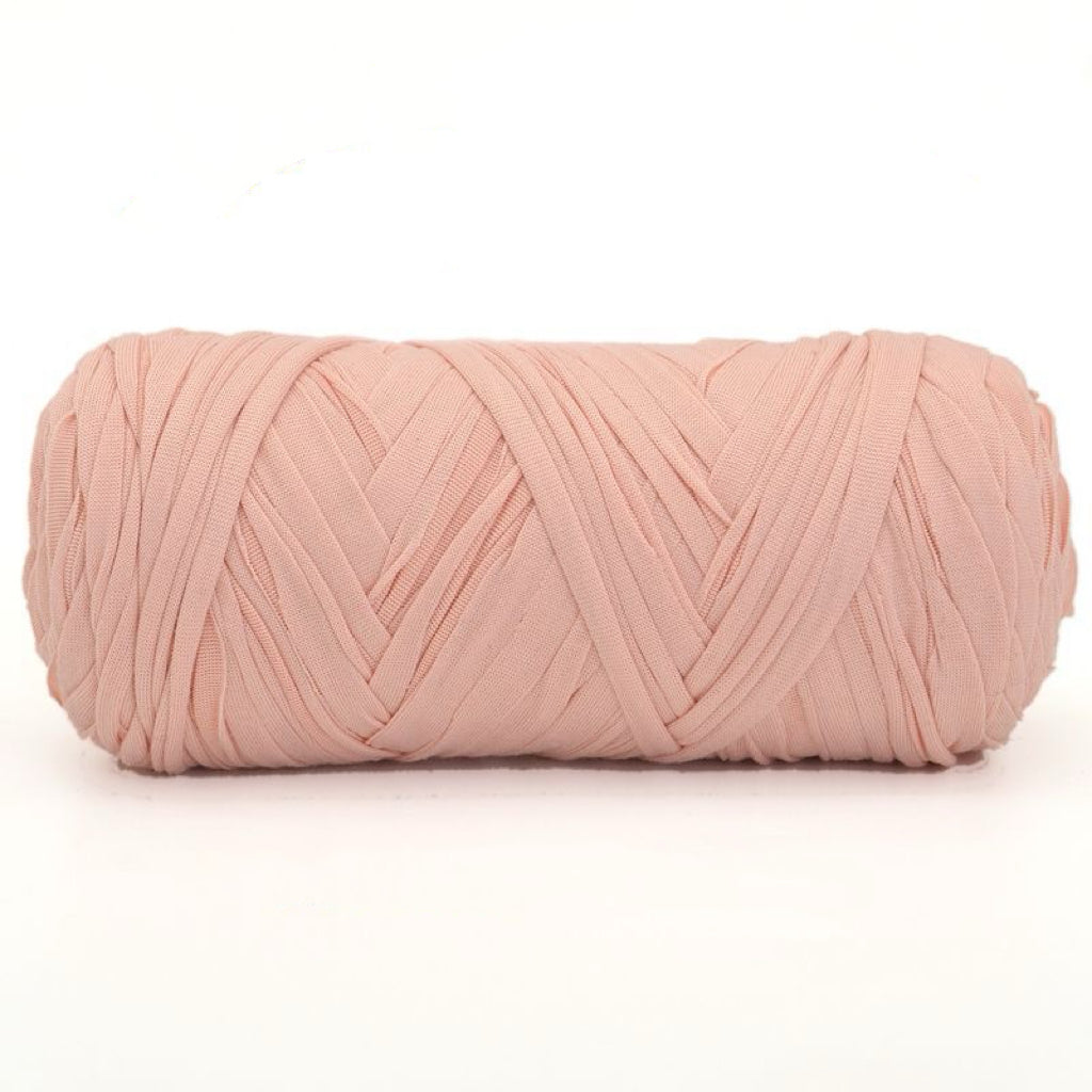 Pink yarn ball on a white background