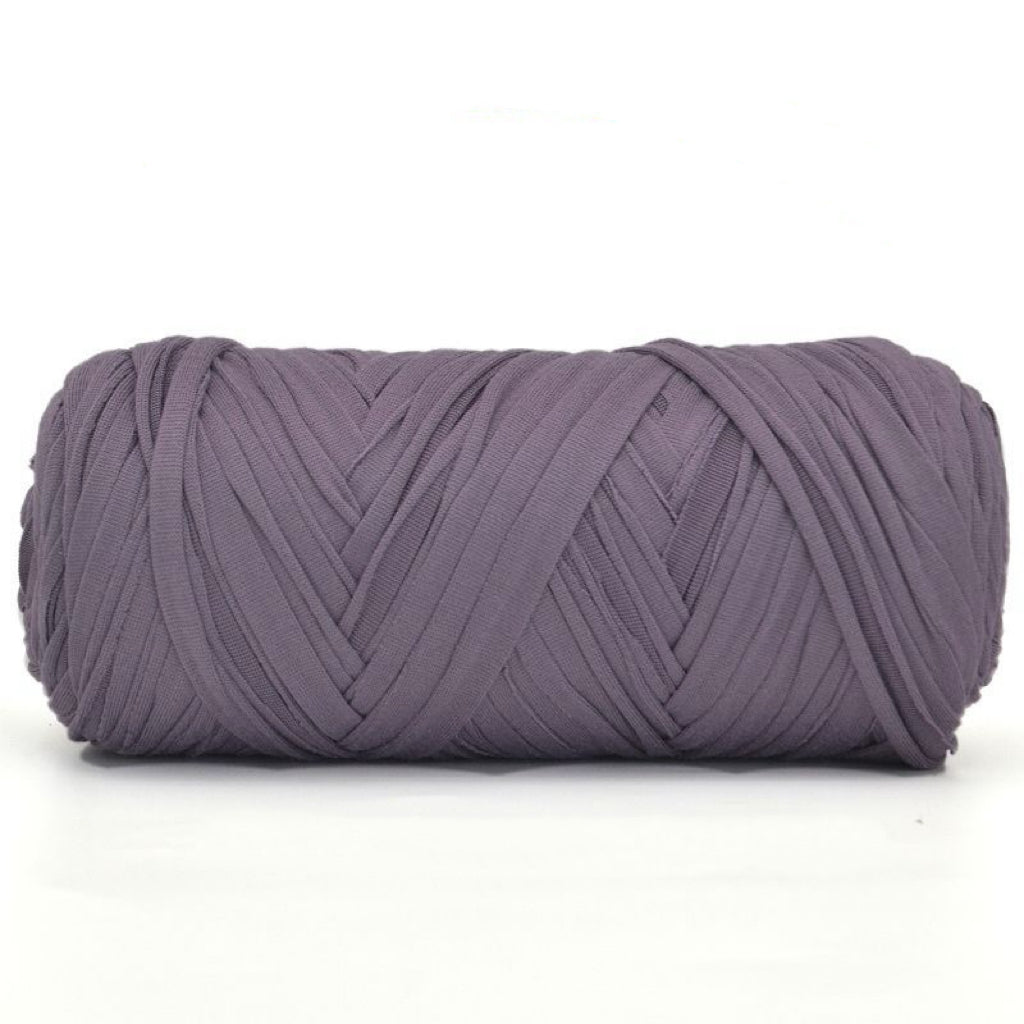 Purple skein of yarn on a white background