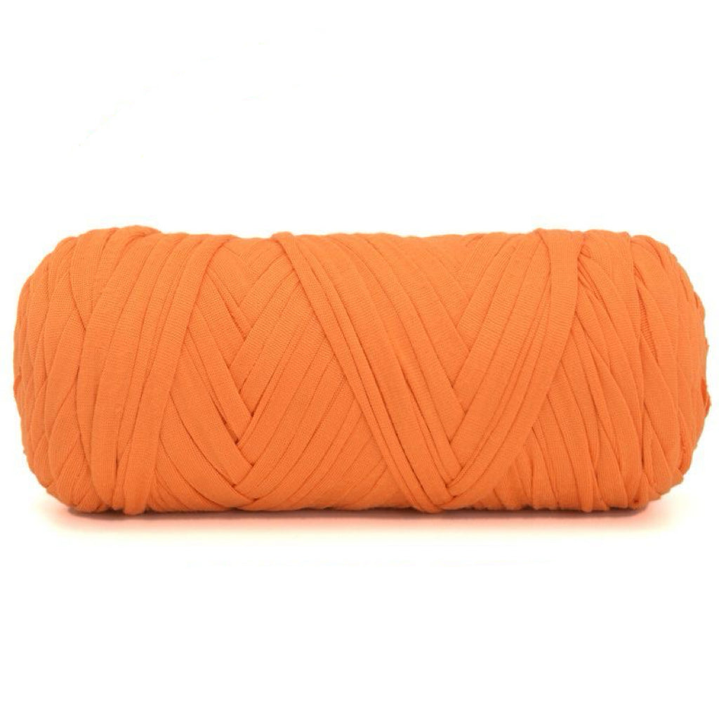 Orange skein of yarn on a white background