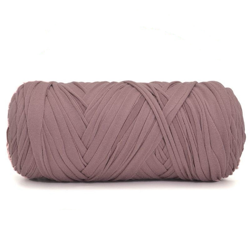 Large ball of taro pink yarn on a white background